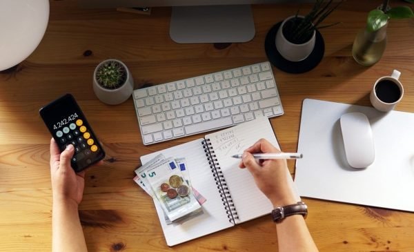 A closeup shot of an entrepreneur working from home on his personal finances and savings